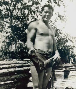 Nelson showing off a baby alligator in the 1930s. Photo courtesy of Loxahatchee River Historical Society
