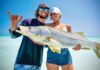 Off the Charts: Reel Paradise Adam and Anika Mellusi show off a giant Jupiter beach–caught snook. Photo by George LaBonte