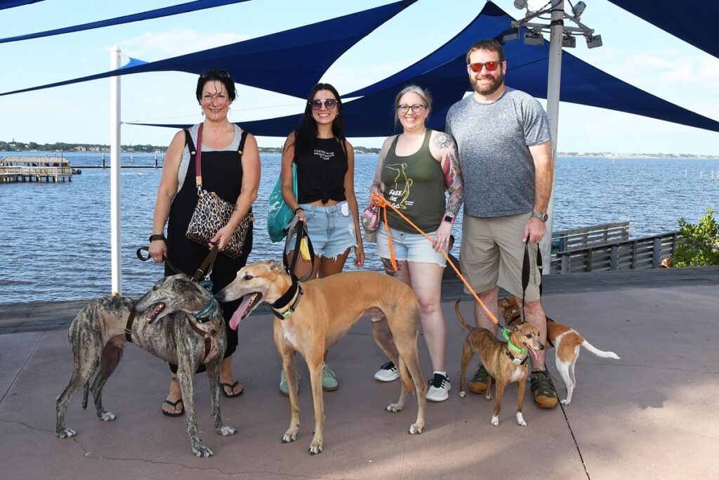 Laura Curry with Ronaldo, Leah Corbett with Ryan, Kim and Paul Hintze with Kala and Feebee at last year’s Pup Crawl