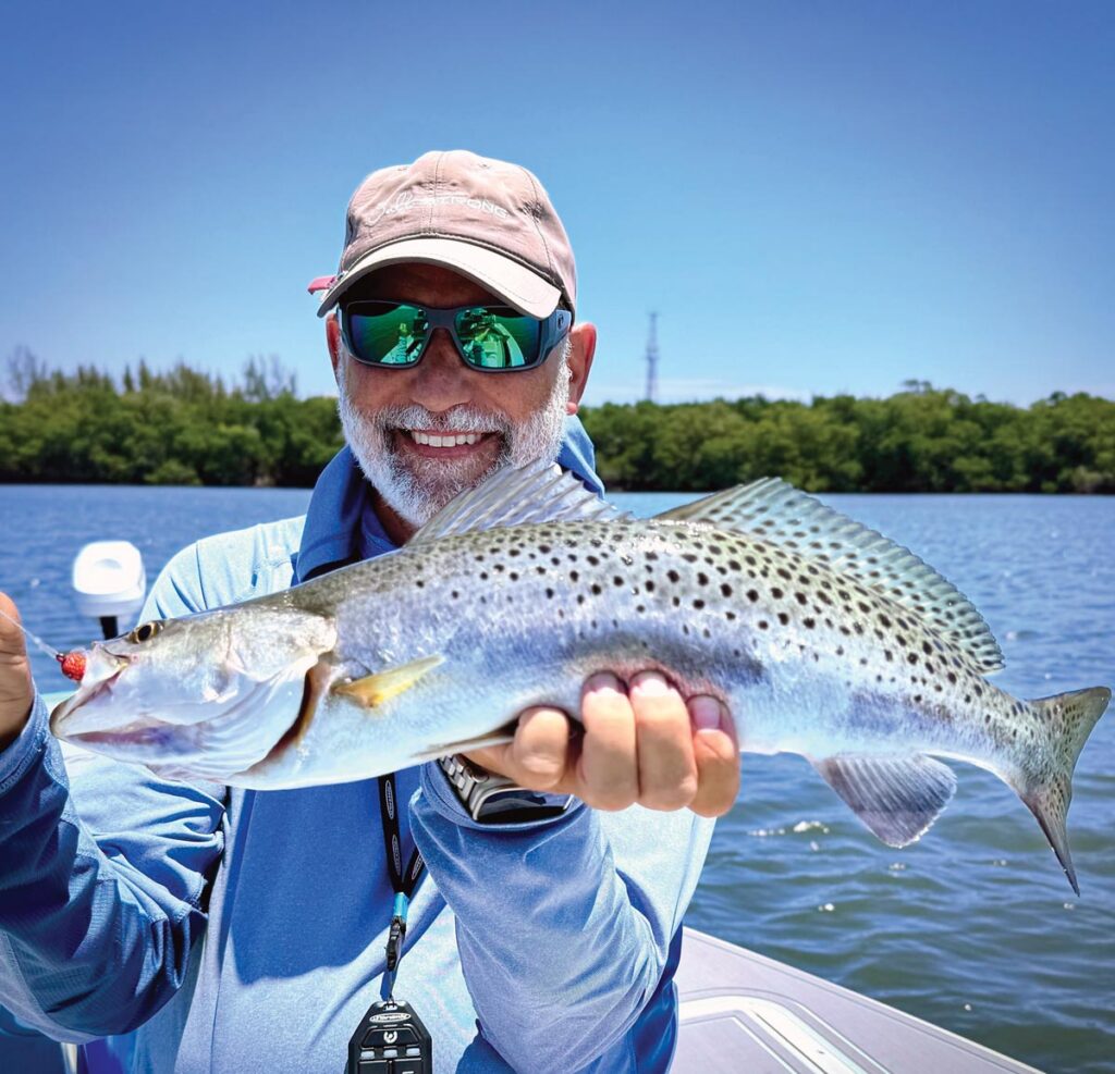 Mitchel Senft enjoys the payoff of a trout bite on the Indian River in Stuart. Photo courtesy of George LaBonte